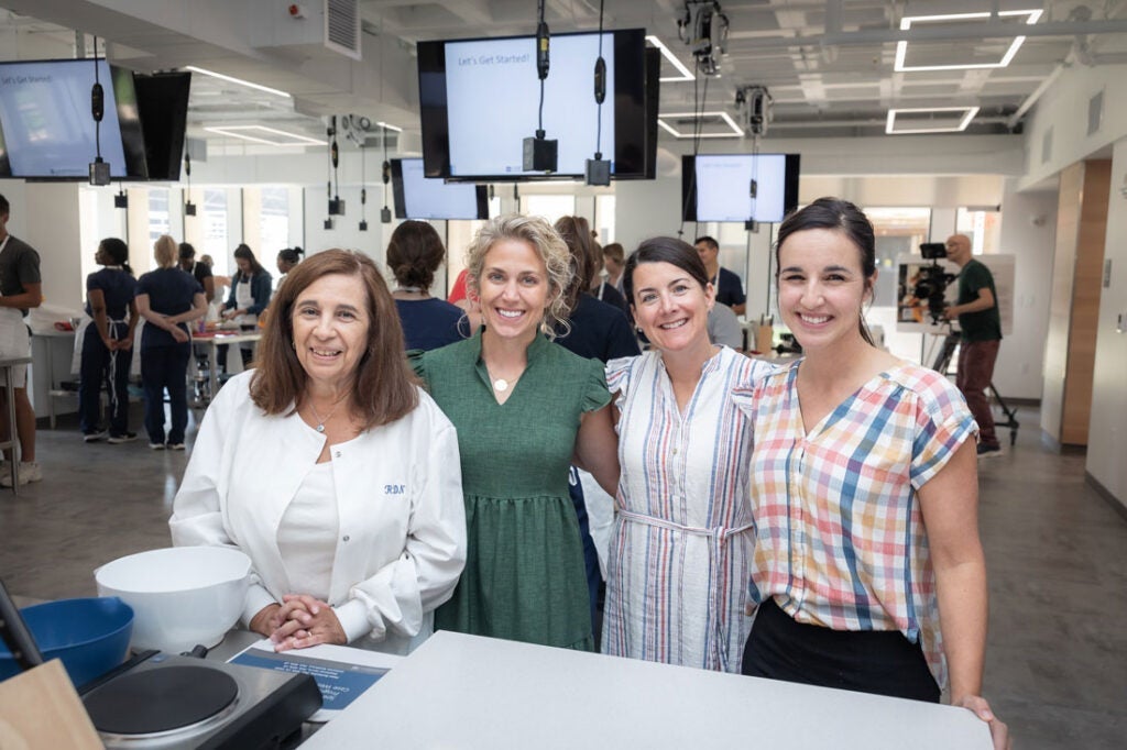 Hope Barkoukis, Stephanie Harris, Lindsay Malone and Ryanne Lachman pose for a photo at the culinary lab