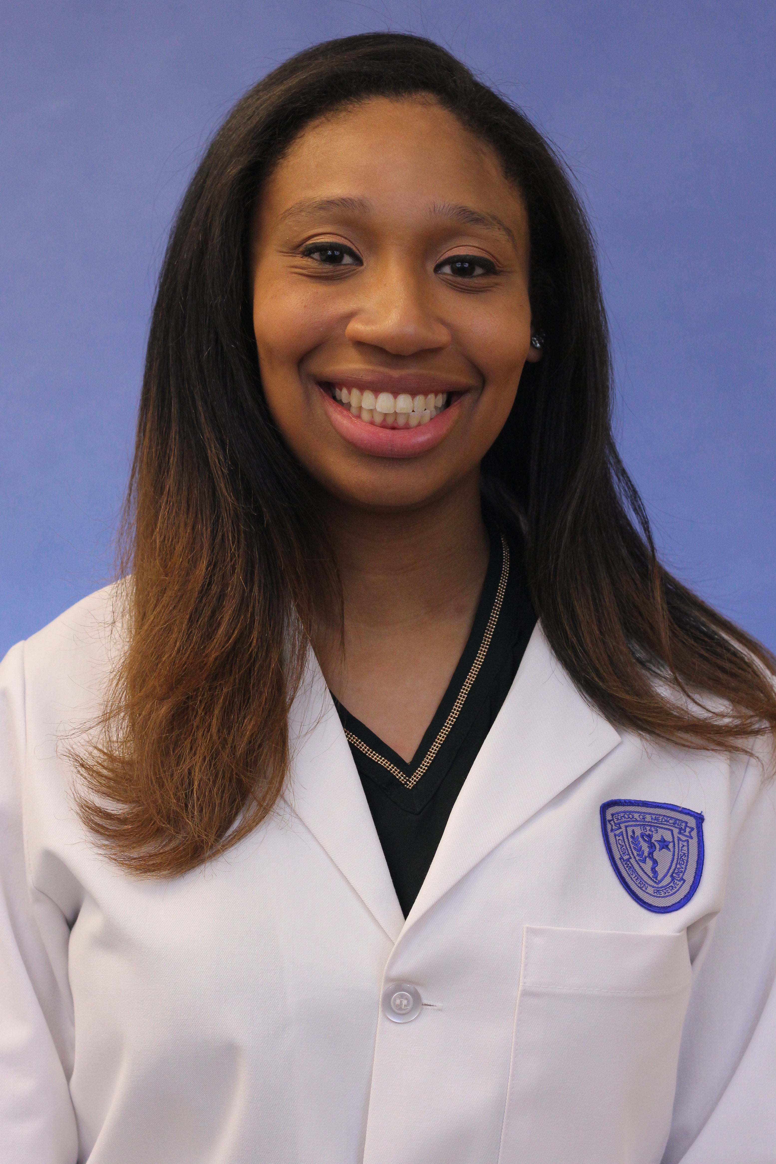 Portrait of Melissa Bonner in med school white coat