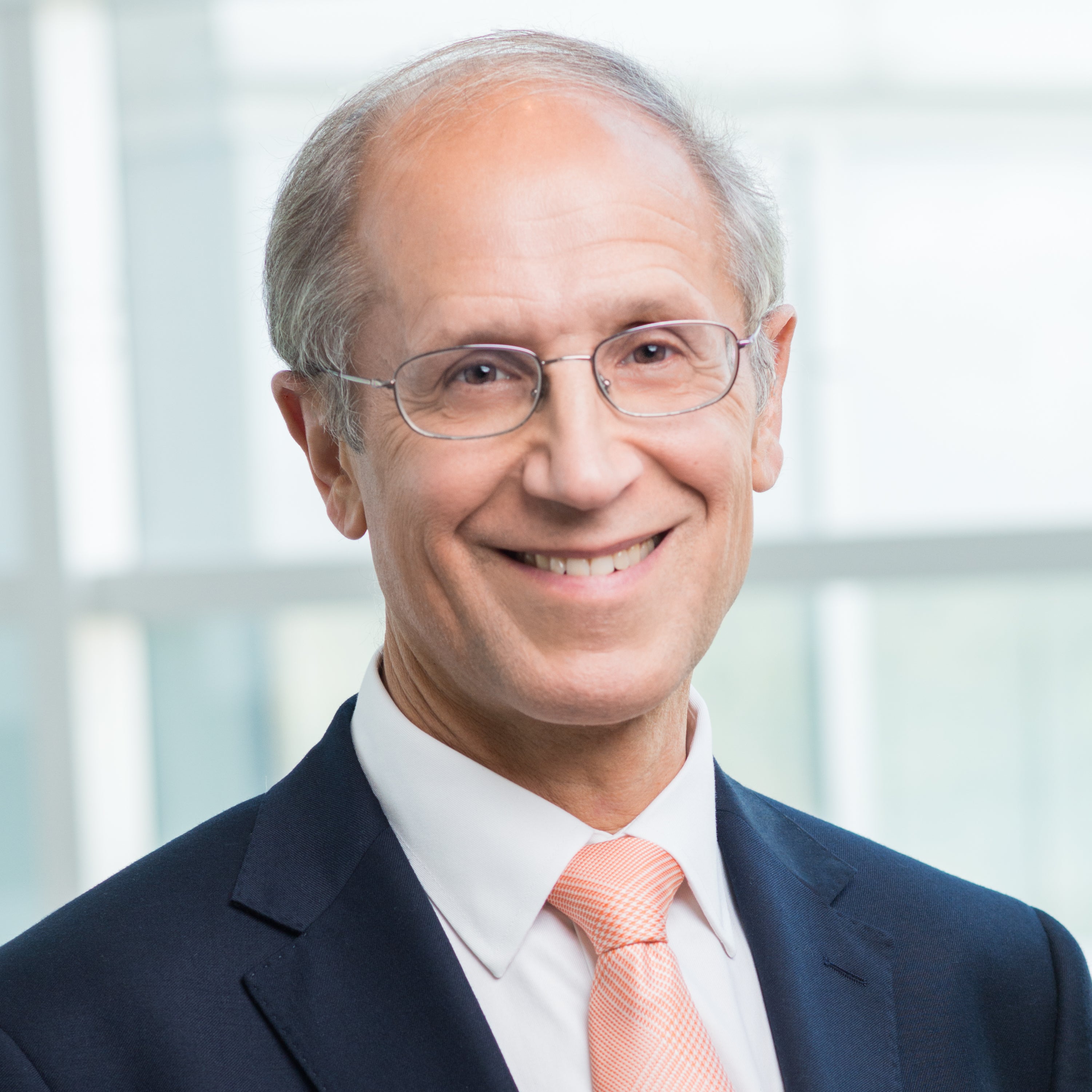 Portrait of Stan Gerson in dark suit with light colored tie