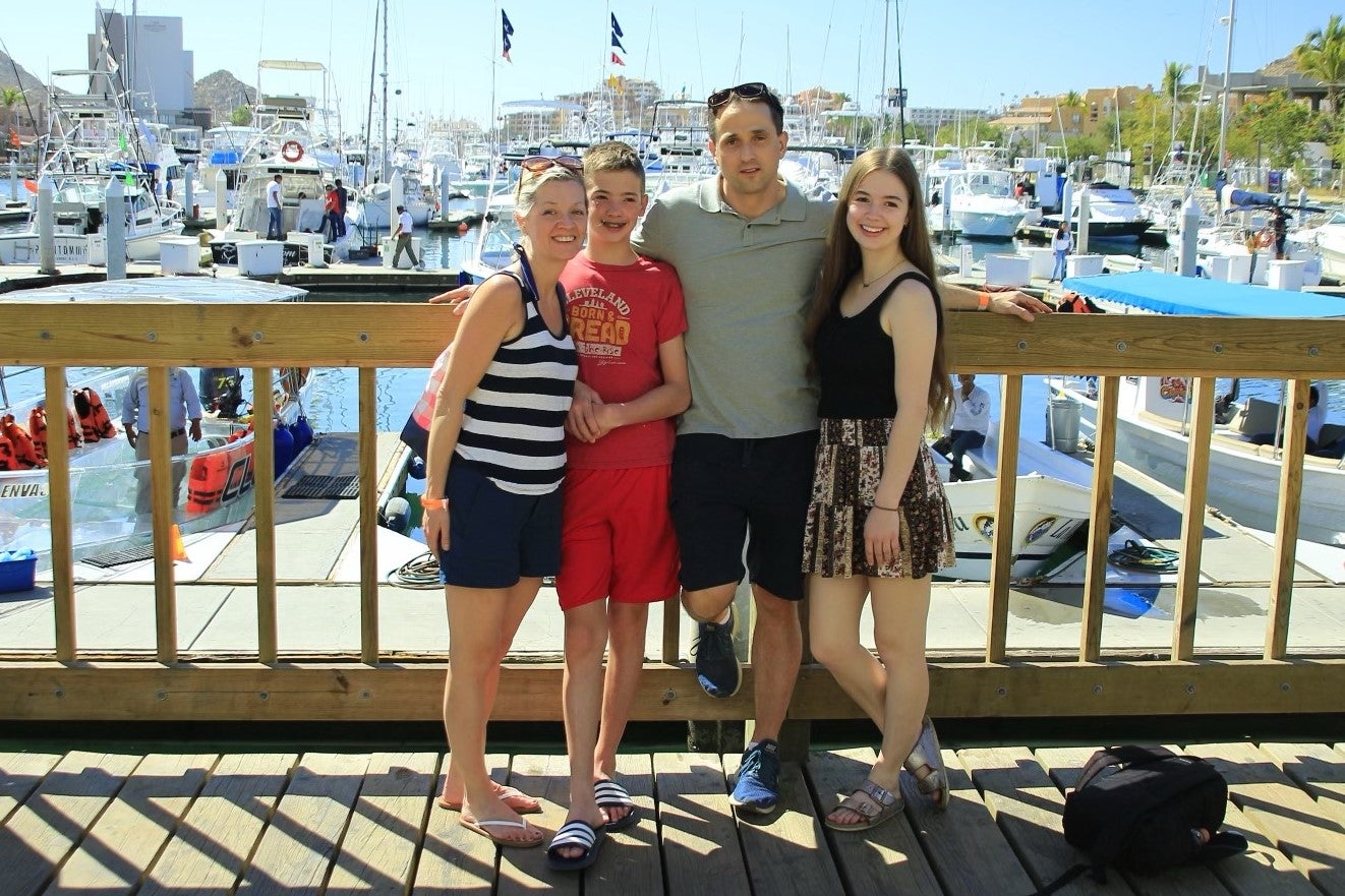 Dr. Rose enjoying time outside, by the lake, with his family.
