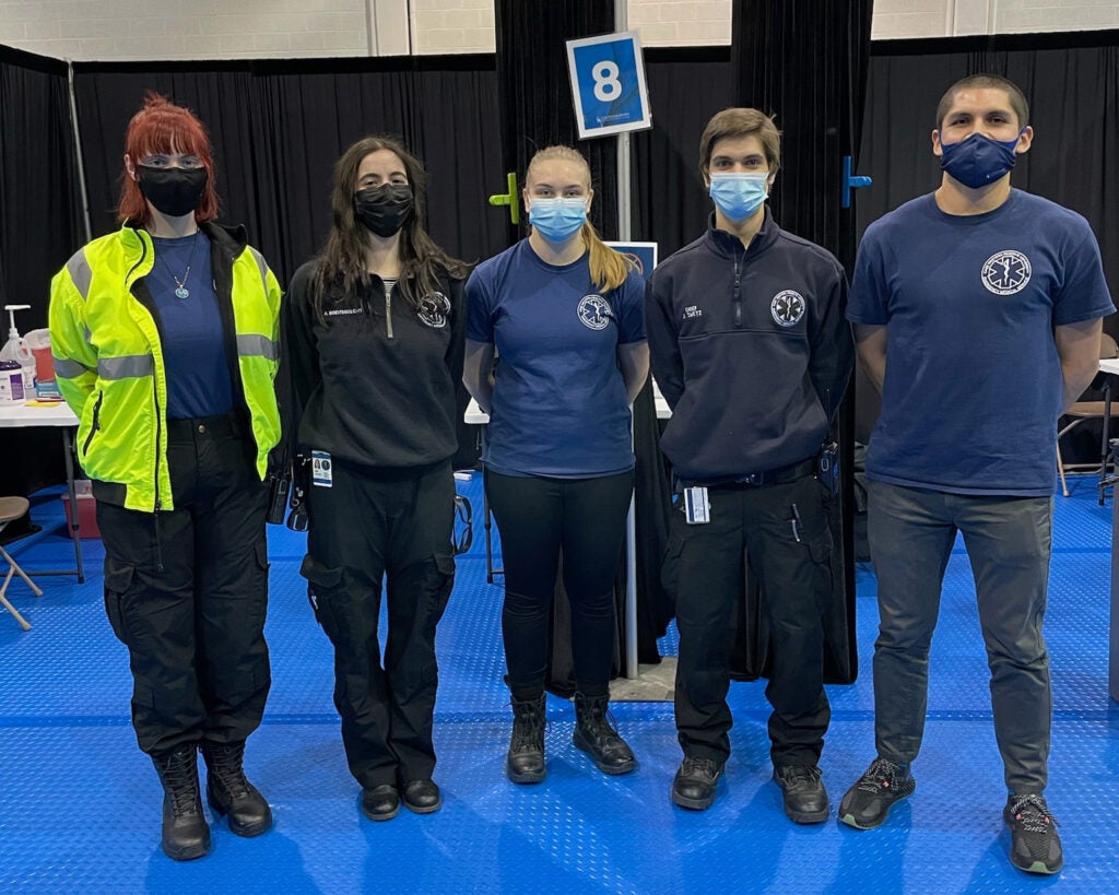 Photo showing members of CWRU EMS posing for a photo at a vaccination clinic