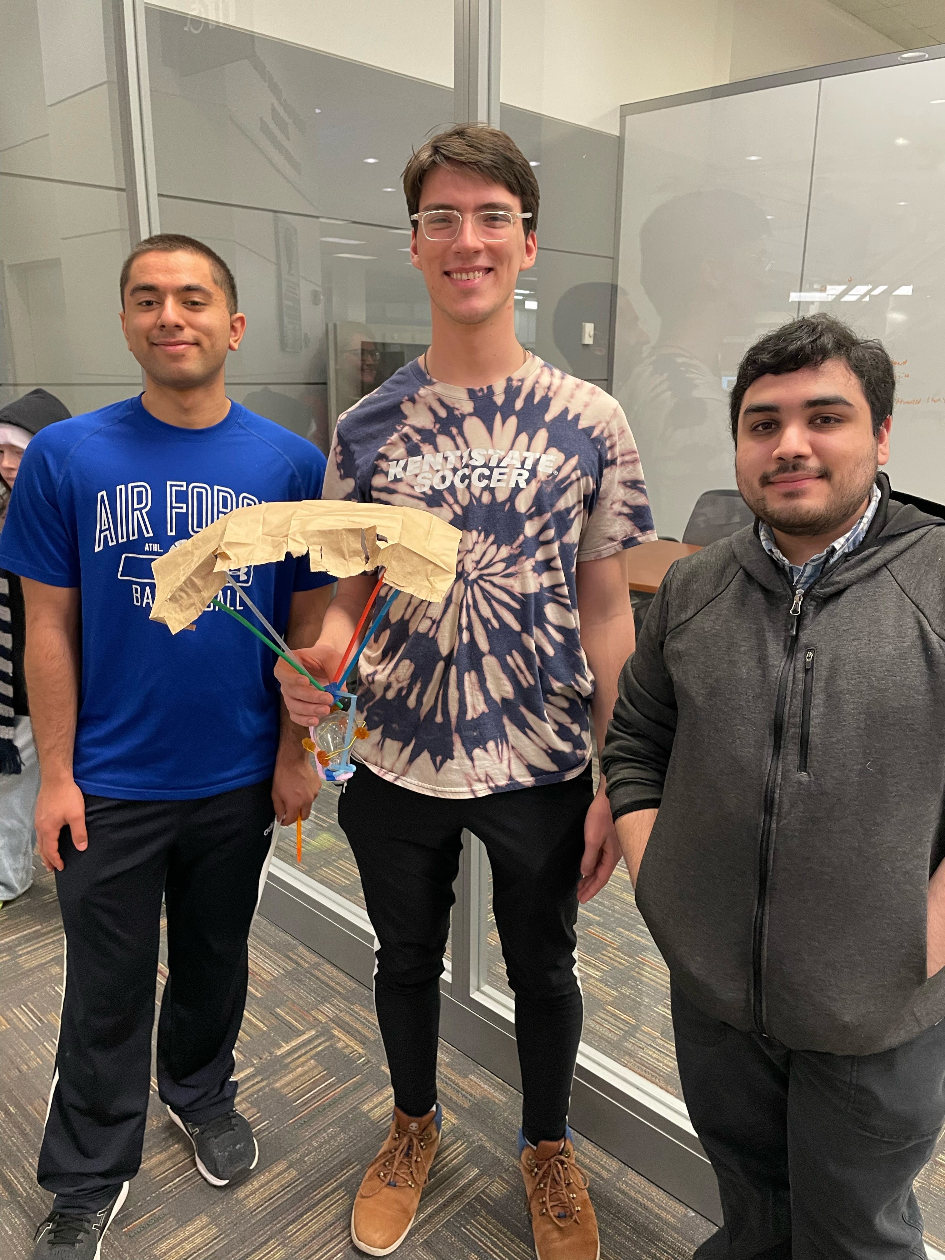 three students winner of WISER light bulb drop competition