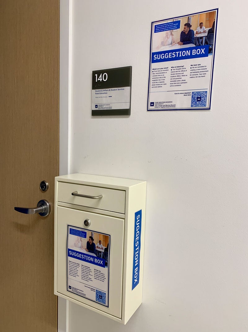 Suggestion box + signage outside Mandel Suite 140