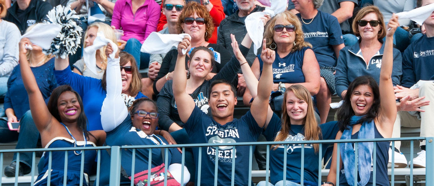 CWRU students and fans cheering in the stands at the homecoming football game
