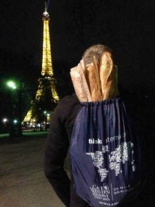 CWRU student standing in front of the Eiffel Tower