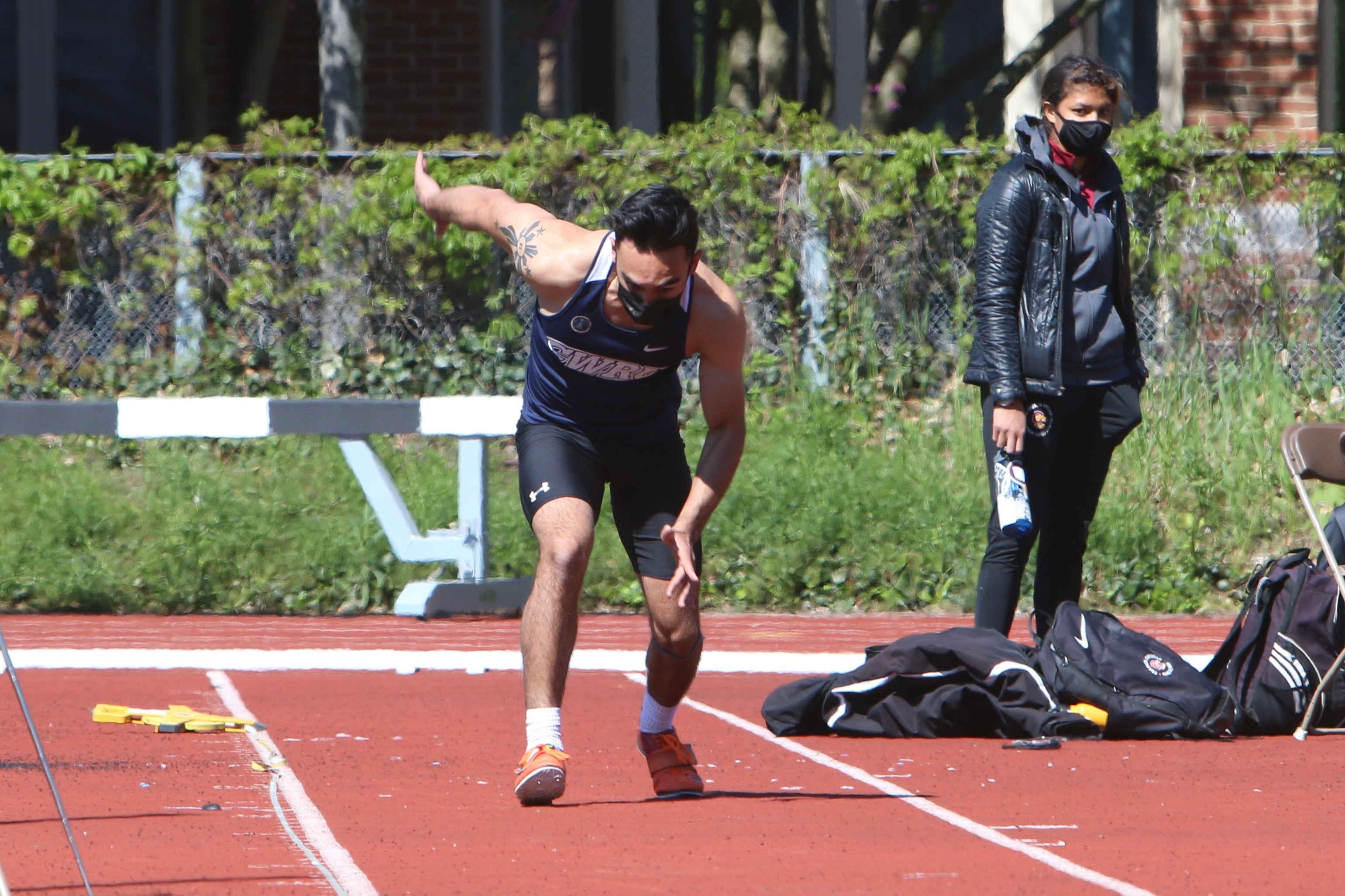 Benjamin Pinkowski gets ready to run during a track and field meet.