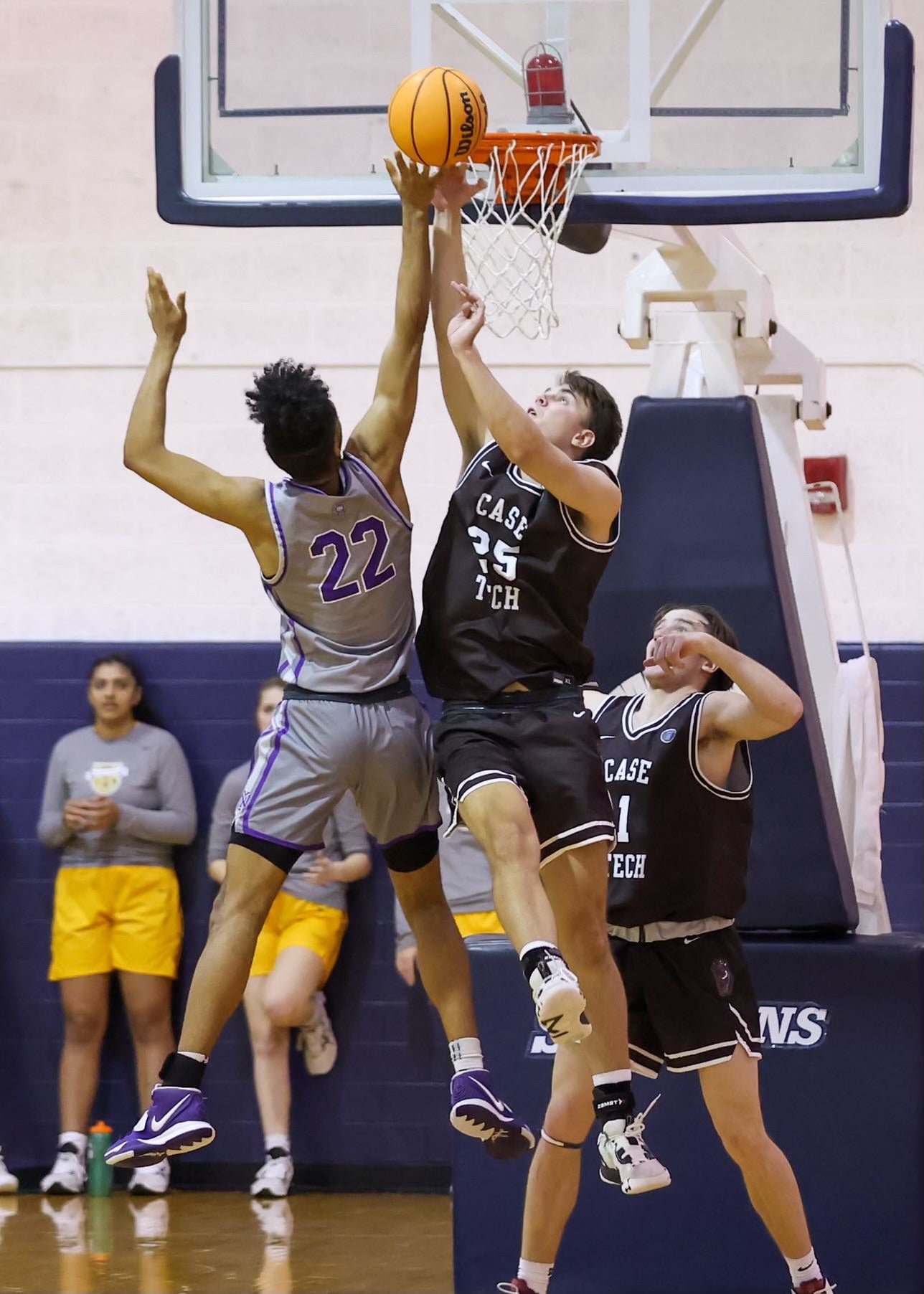 Ian Elam tries a layup during a game of basketball.