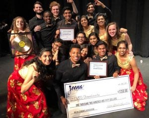 Dhamakapella team poses for photo with check from win at Jeena 2017