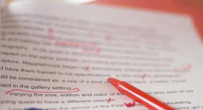 Essay paper with edits and red pen