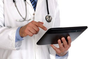 electronic-records doctor using tablet