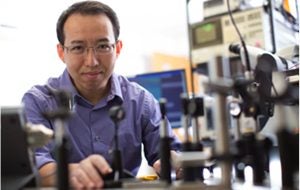 Philip Feng working in a lab