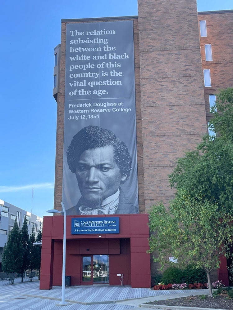 Photo of the Frederick Douglass banner hanging off the University Bookstore that quotes him: “The relation subsisting between the white and black people of this country is the vital question of the age.”