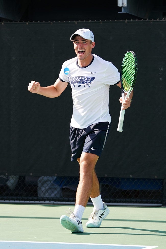 Photo of James Hopper celebrating on the tennis court during the national championship match