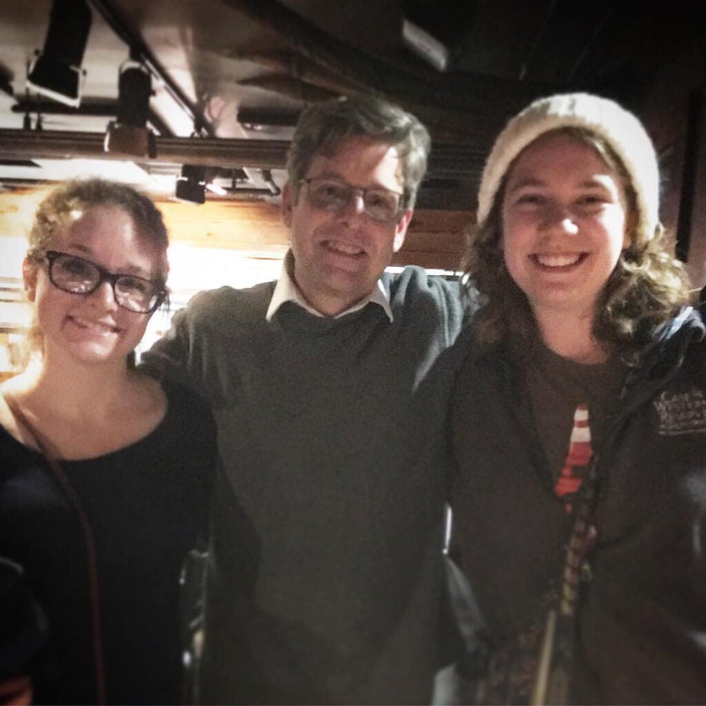 Jim Sheeler poses for a photo with Anne Nickoloff and Julia Bianco