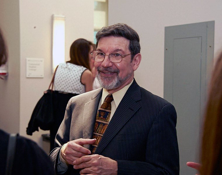 Photo of Jonathan Entin talking to other individuals