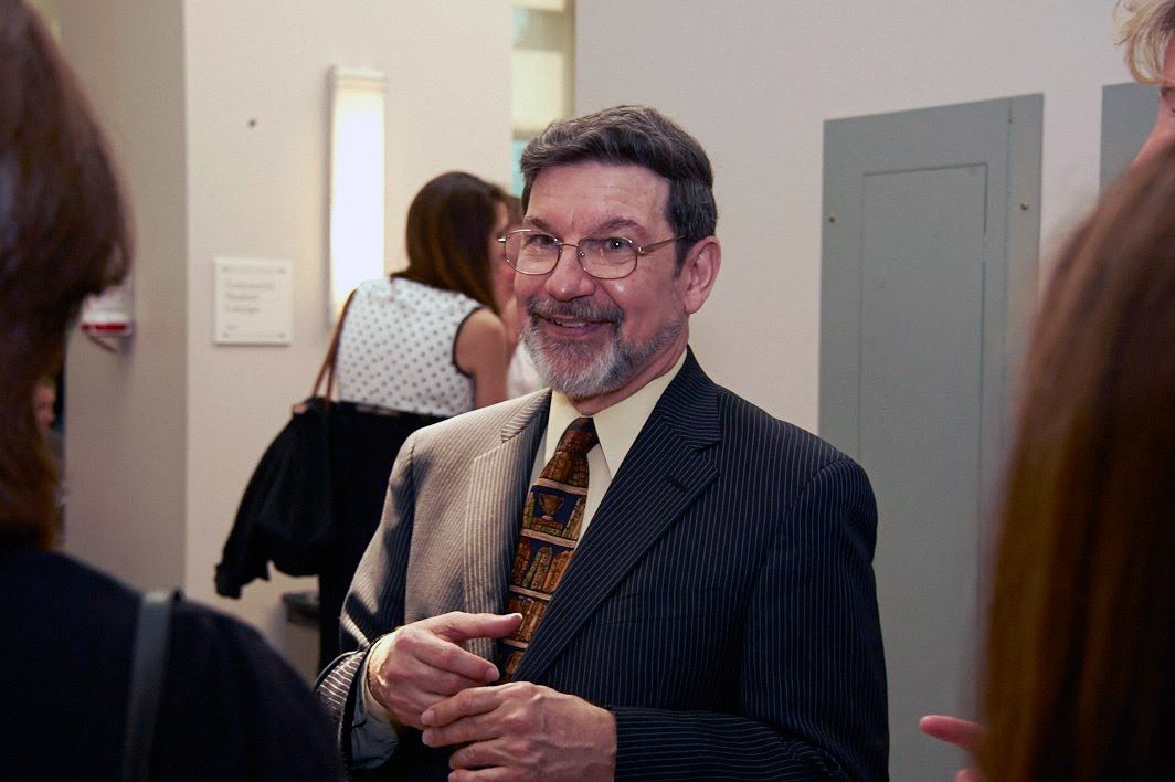 Photo of Jonathan Entin talking to other individuals