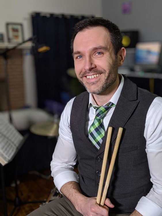 Photo of Ken Wendt holding drum sticks