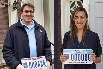 Andrew Getsy and Rachel Katz holding Ohio license plates