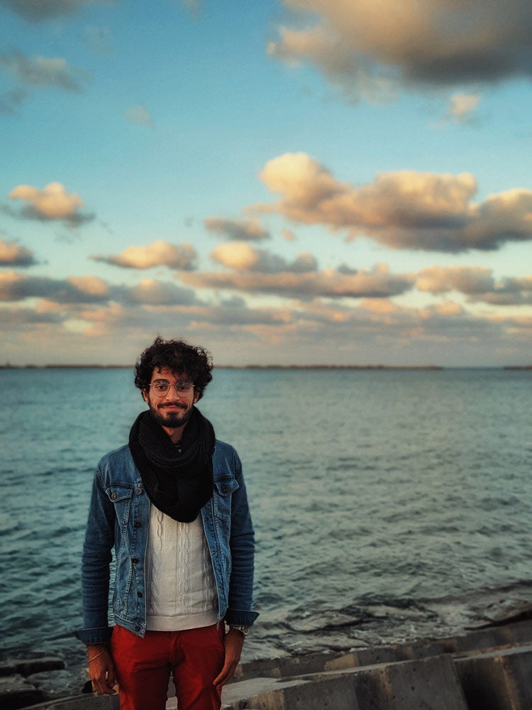 Photo of Mahamad Salah Mahmoud in front of a body of water