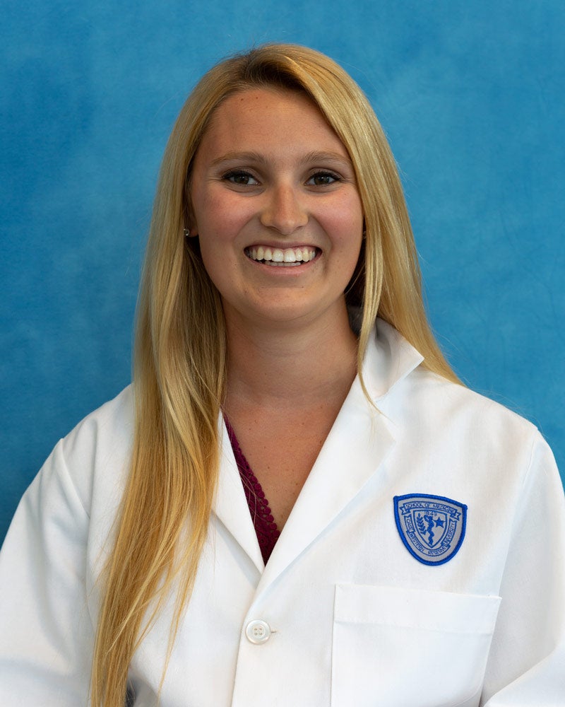Photo of Madeline McKenna wearing a white coat