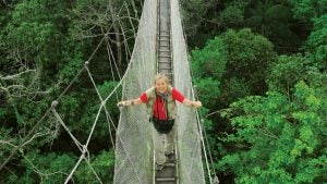Margaret Lowman on bridge over forest canopies