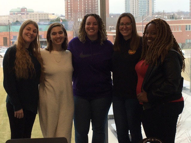 Five CWRU students pose for a photo