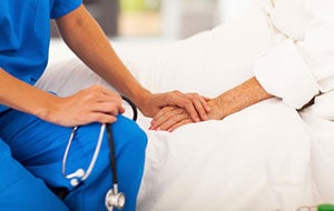 Photo of nurse comforting patient