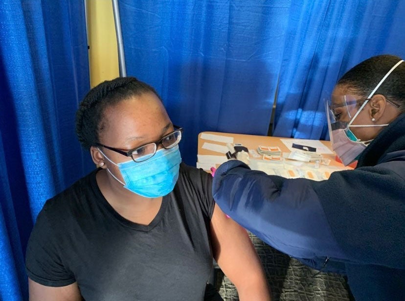 Photo of Olubukola Abiona getting her COVID shot