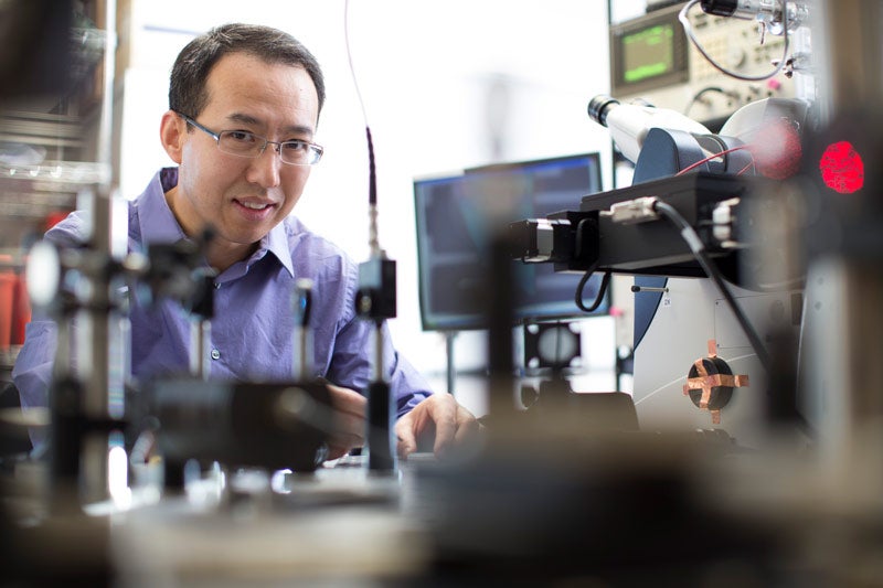Photo of Philip Feng in a lab setting