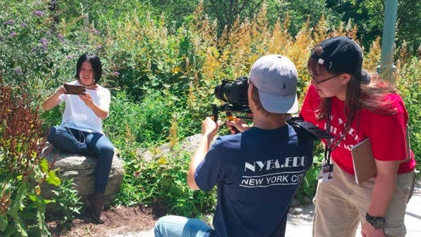 Rebekah Camp with another filmmaker in a garden