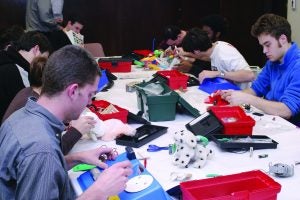 CWRU students repairing toys at replay for kids