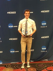 Sam Merriman holds Elite 90 trophy