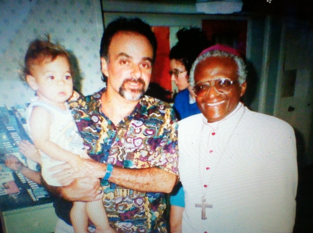 Michael Scarpaci as an infant with Desmond Tutu