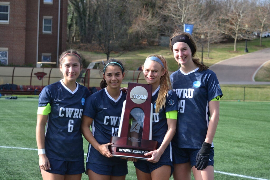 CWRU women's soccer captains senior Lexi Gomez, senior Anika Washburn, senior Merry Meyer, senior Elizabeth White with the runner-up trophy