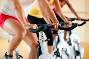 People excercsing in a spinning class