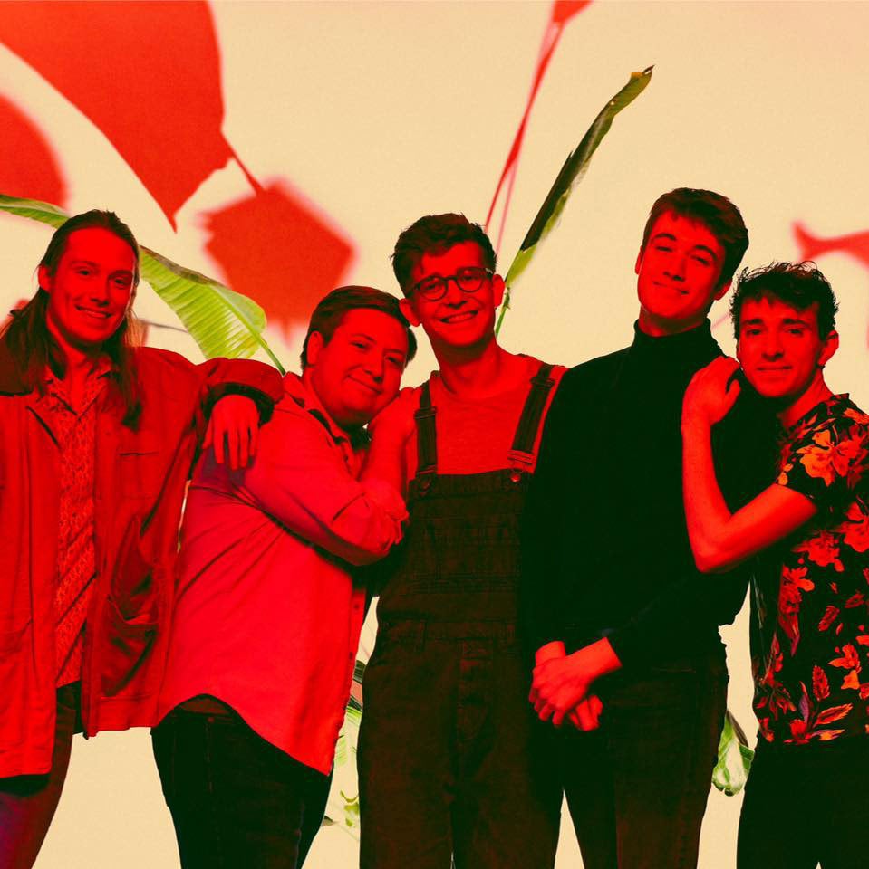 Posed photo of the five members of the music group Spirit of the Bear with a red overlay
