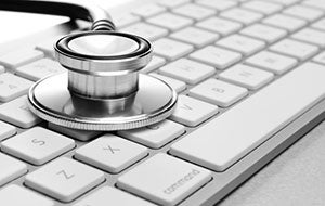 stethoscope on computer keyboard