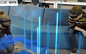 Students looking at virtual charts using hololens