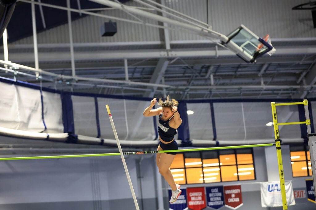 Photo of Victoria Zhao competing in a pole vaulting competition