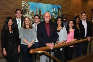 Robert S. Reitman (LAW '58) joined current School of Law students for the unveiling of a Cleveland-themed mural in the school’s atrium. Reitman, George N. Aronoff (LAW ’58) and James H. Berick (LAW ’58) matched gifts from the law school's class of 2015 to fund the artwork. Photo by Ruggero Fatica.