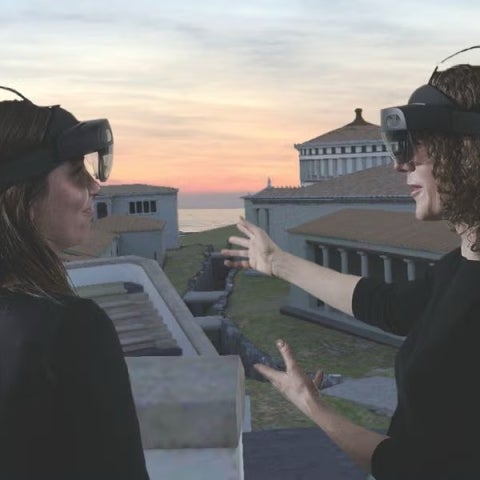 Maggie Popkin with students looking at Samothrace