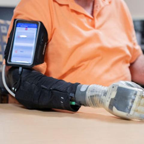 Photo showing a man using an advanced prosthesis