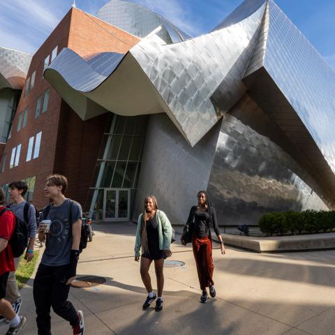Photo of students walking in front of the Peter B. Lewis Building at CWRU