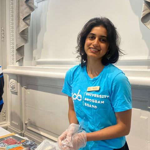 Harini Ganapathy assists at a volunteering event with the University Program Board.