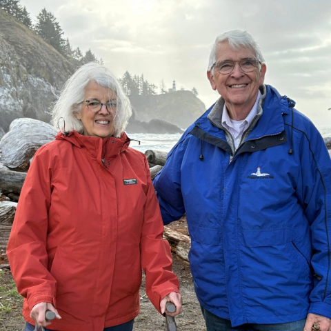 Ed and Melinda Sadar in the mountains wearing winter gear