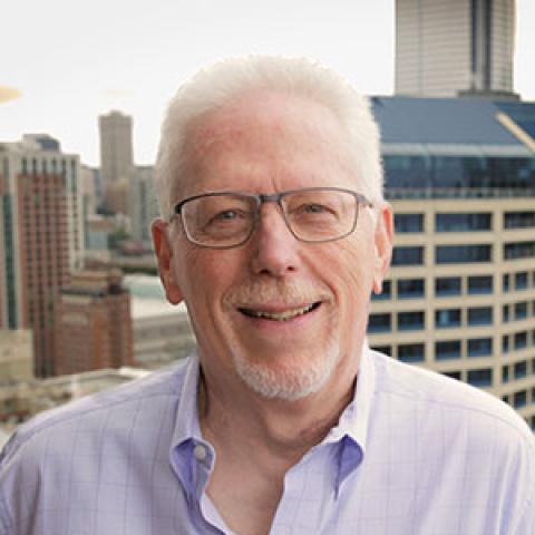 Grant Saviers photo with a city scape in the background