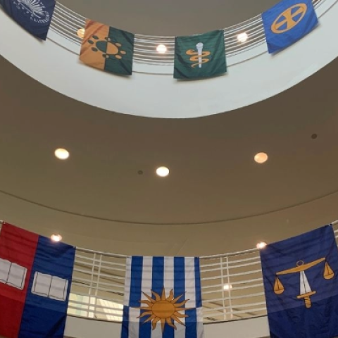 Image of a large stairway area with banners displayed across railings