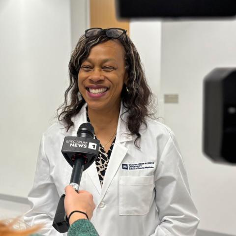 Photo of School of Dental Medicine faculty member Kristin Williams being interviewed by the news