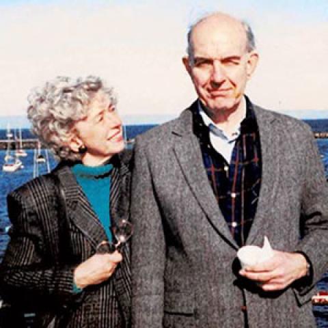 Ann and Dr. James Swinehart standing in front of the water