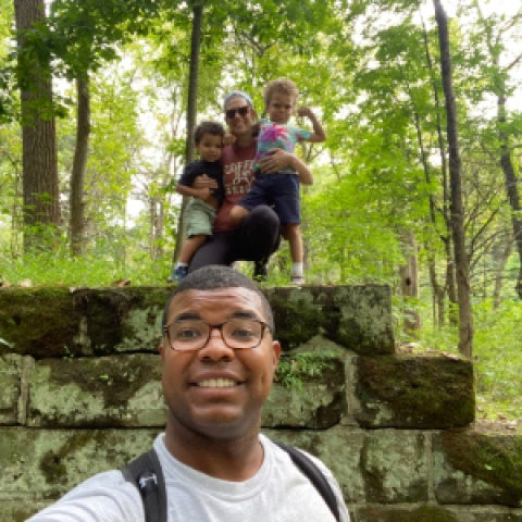 Brock Montgomery hiking with his wife and two children